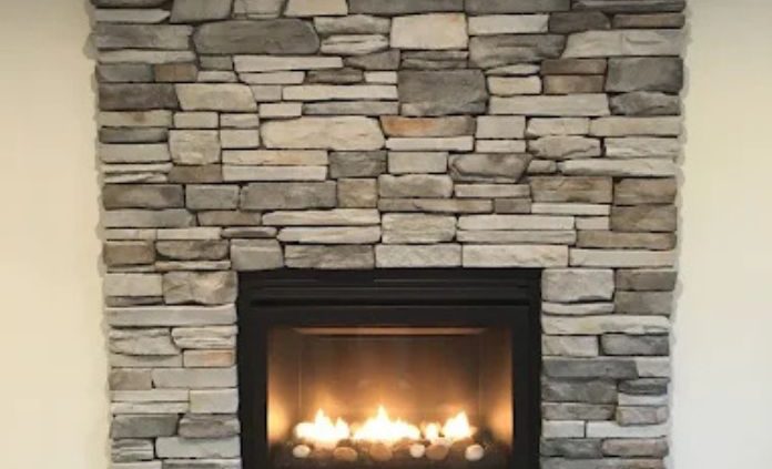 stacked stone gas fireplace - We Finish Basements basement finishing near